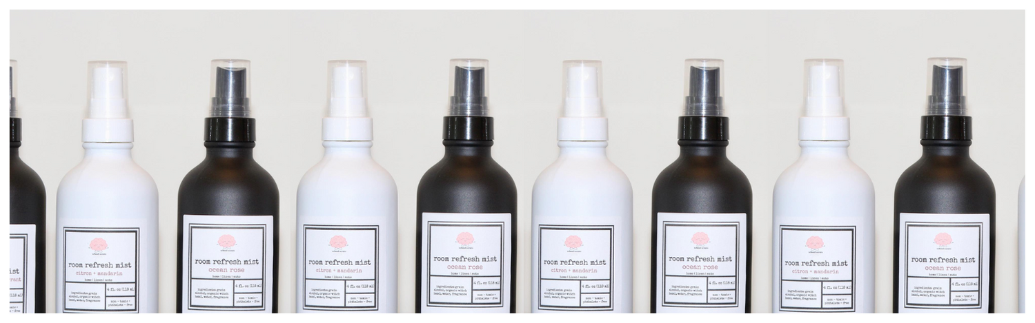 School Scents room and linen spray bottles arranged in a clean, minimalist row